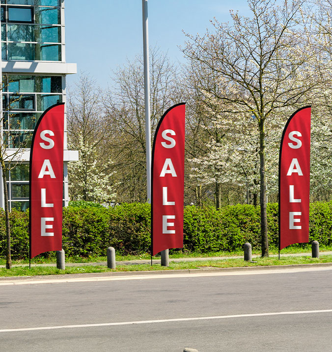 sale-feather-flags-or-feather-banner-in-front-of-an-office-building